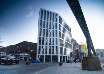 Sleek urban living: a towering student residence with a striking facade stands tall in the heart of Coventry.